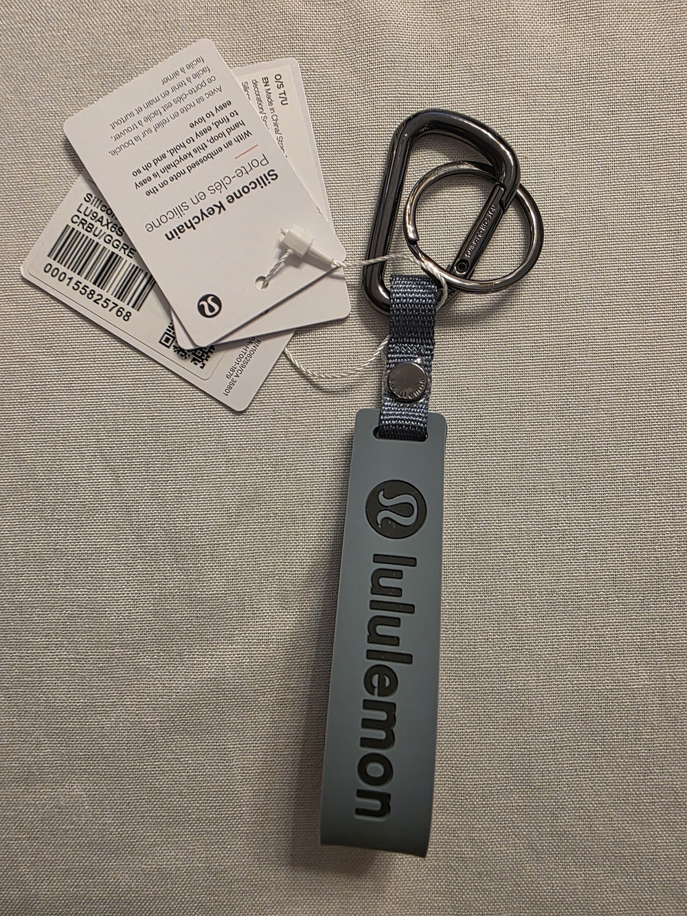 lululemon athletica Silicone Key Fob in Gray-Blue with Metal Ring.